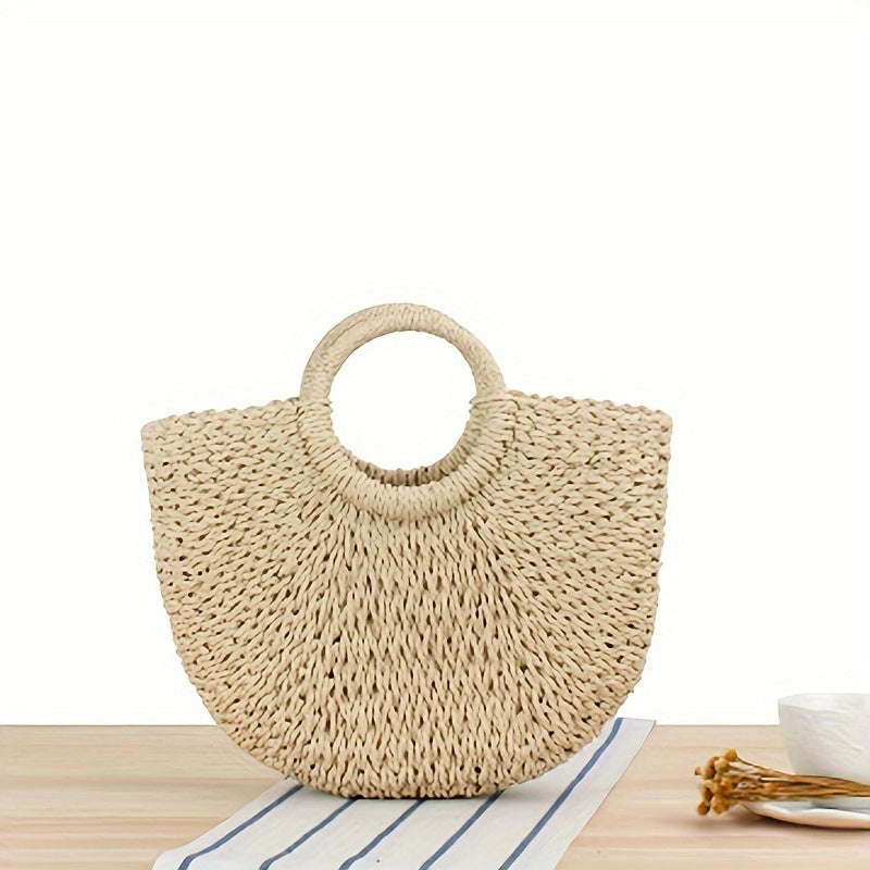 OCTAVIA | Bolso en forma de media luna de paja trenzada en color beige natural