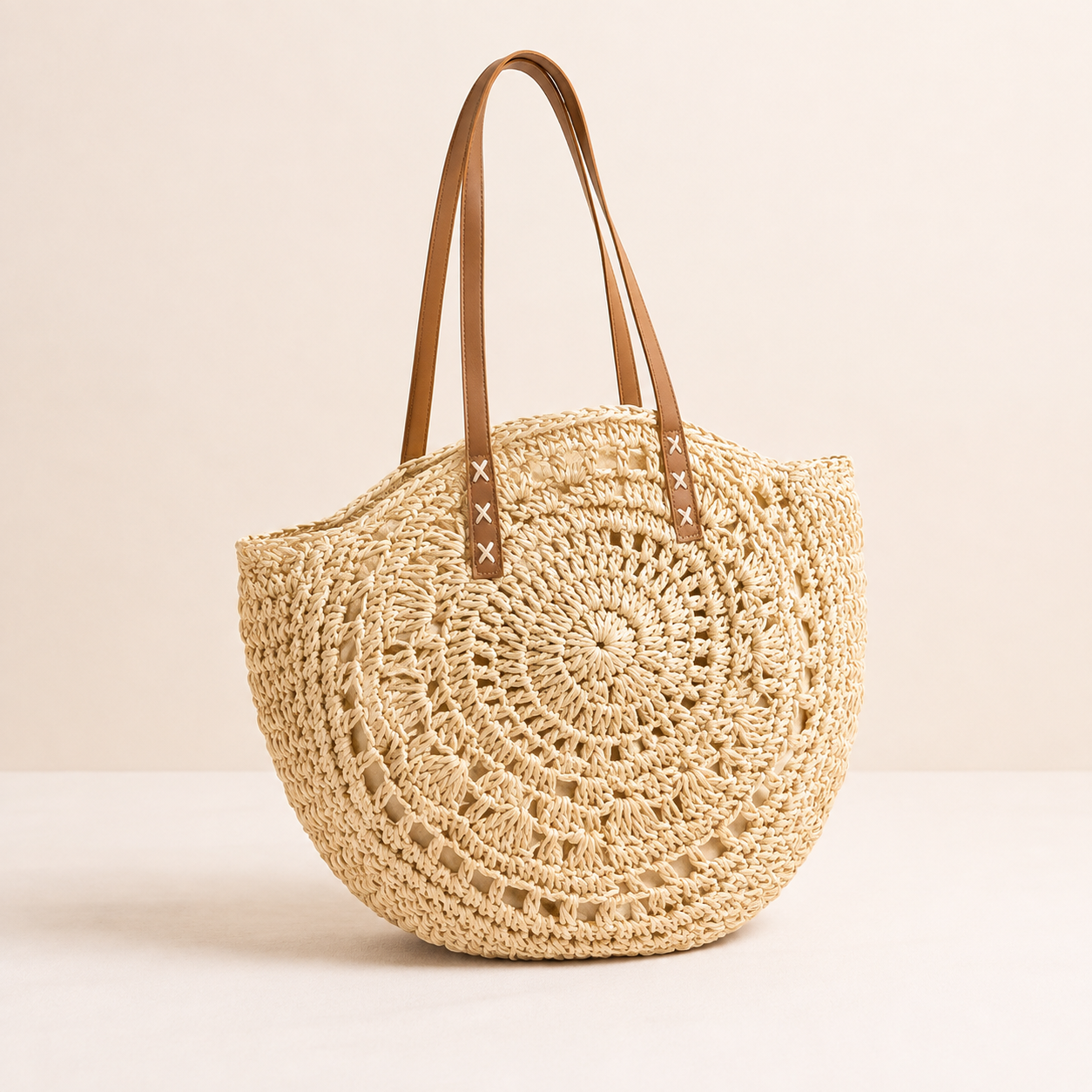 LUCIA | Bolso redondo de paja trenzada con motivo — Beige natural